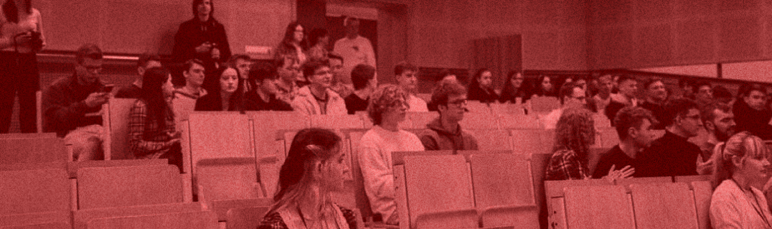 Photo of conference participants sitting in the auditorium.